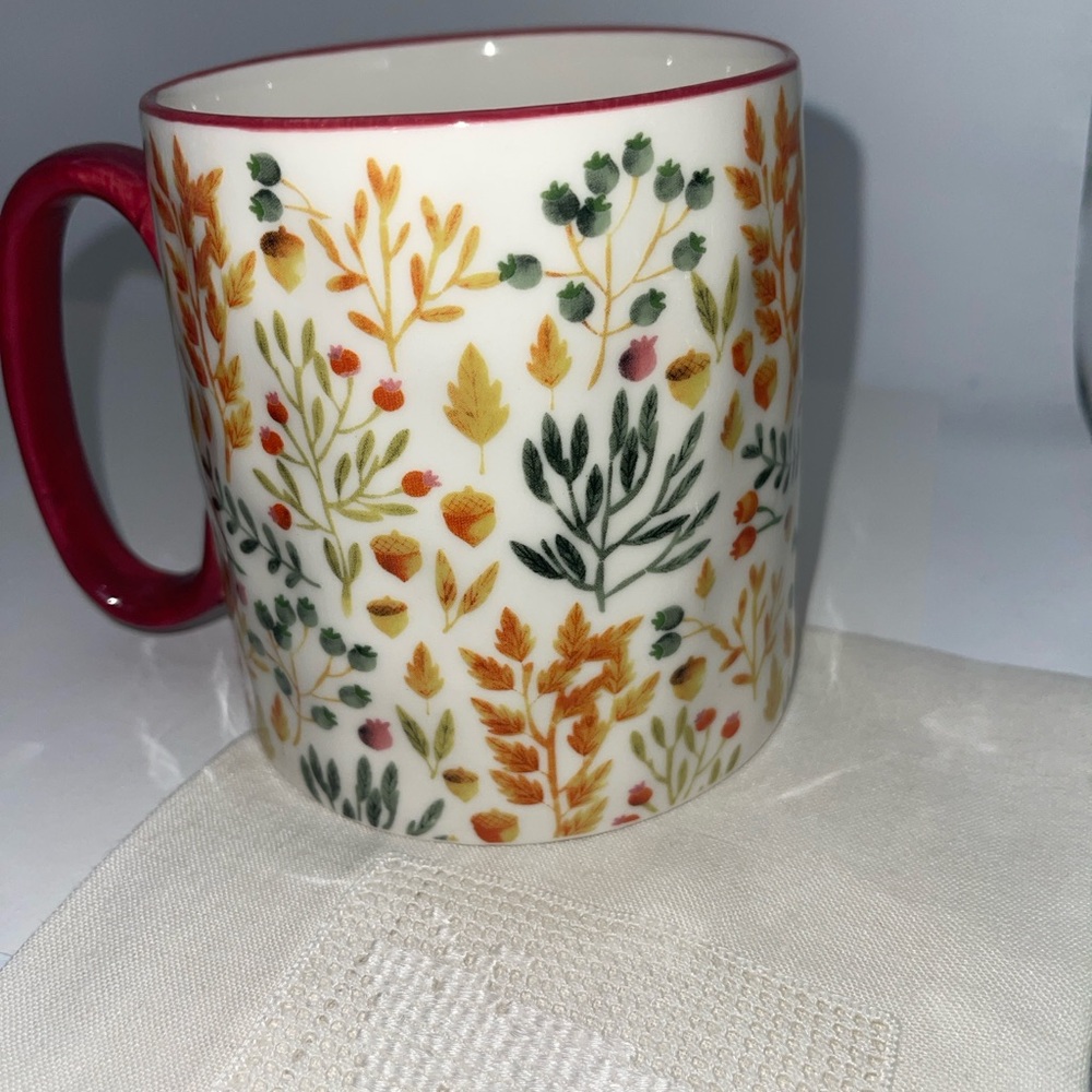 Floral Patterned Ceramic Mug with Red Handle
